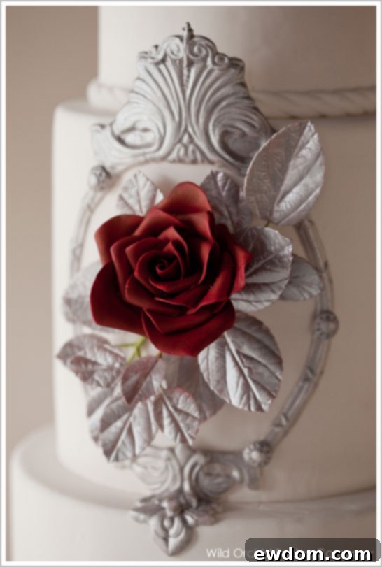 Close-up of Modern Snow White Cake with Detailed Mirror Frame and Rose
