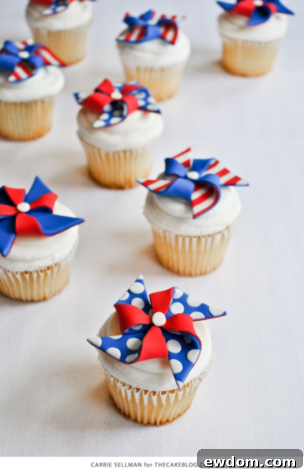 Finished patriotic pinwheel cupcakes with both striped and polka dot fondant toppers, ready for celebration