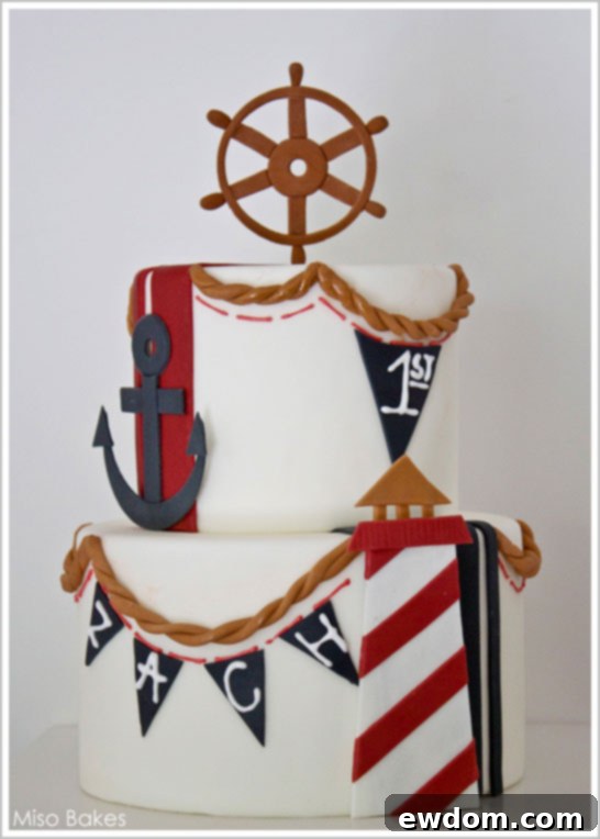 Nautical Beach Cake by Miso Bakes | TheCakeBlog.com Close-up of the Nautical Cake by Miso Bakes, highlighting pennants and ship wheel.