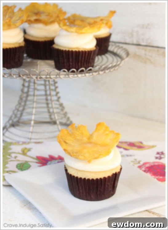 Delicious Tropical Pineapple Cupcake Recipe with creamy frosting | TheCakeBlog.com