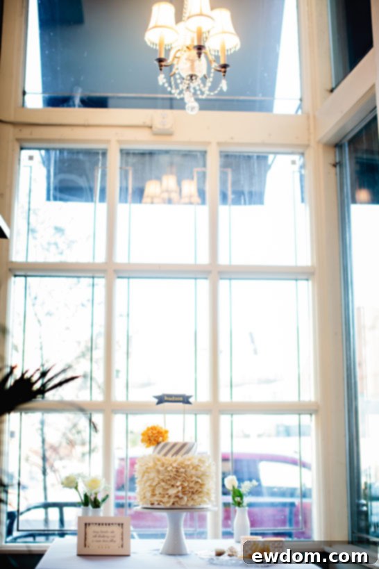 Beautifully crafted spiral stripes on the top tier of the baby shower cake, mimicking modern party straws with elegant precision.