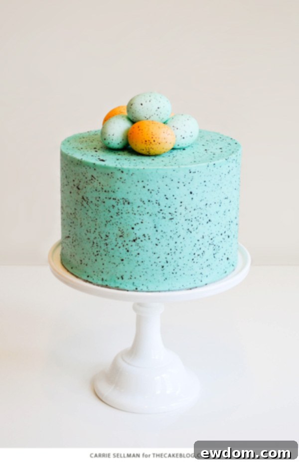 Flecked Fable Cake 7 A slice of Speckled Easter Egg Cake, showing the beautiful blue layers and chocolate speckles on the frosting. | by Carrie Sellman for TheCakeBlog.com