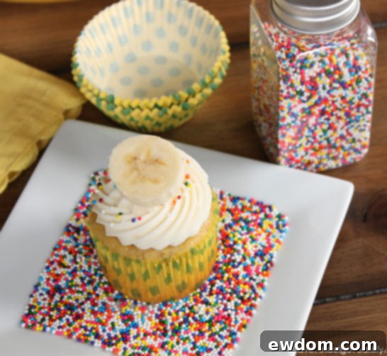 Irresistible Banana & Cream Cheese Cupcakes topped with creamy frosting, perfect for any celebration or treat | TheCakeBlog.com