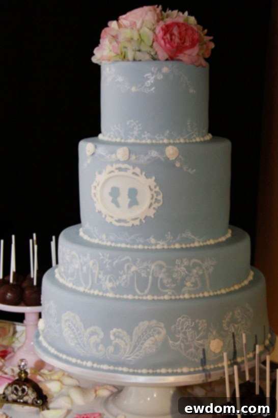 Elegant Cameo Confection 5 Detail shot of delicate lace patterns and blush flowers on an Intricate Icings wedding cake
