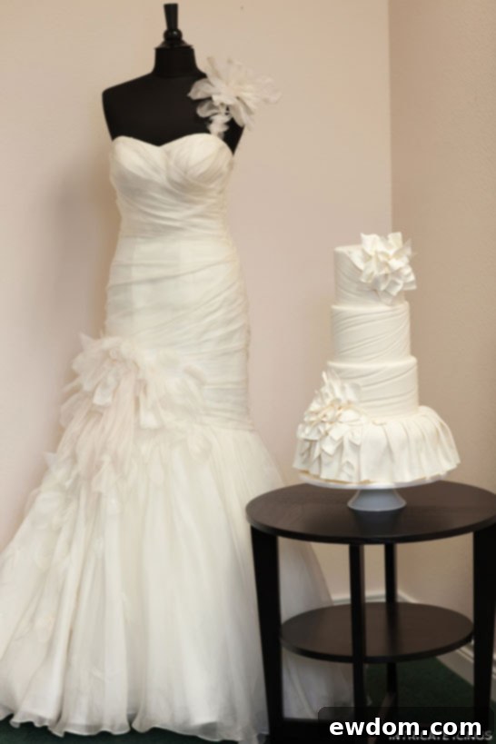 Close-up detail of the Martina Liana dress and the fashion-inspired cake