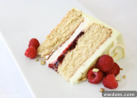 Pistachio Cake with White Chocolate & Raspberries by Tessa Huff | TheCakeBlog.com