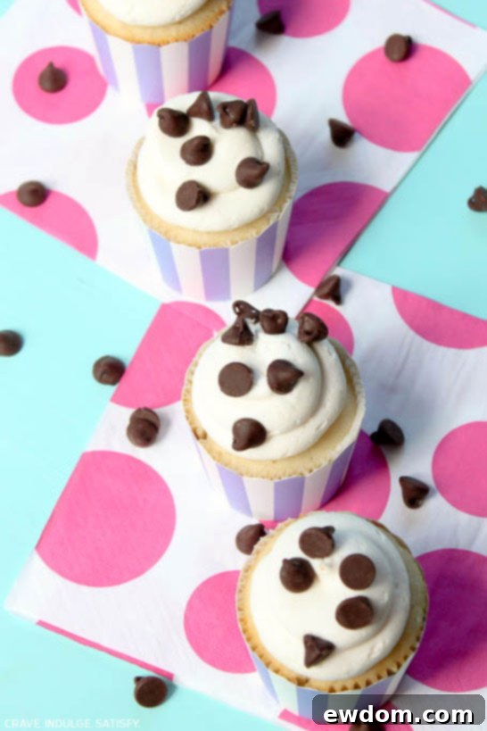 Ultimate Chocolate Chip Cupcakes 5 Beautifully frosted Chocolate Chip Cupcakes with extra chips on top, ready for serving