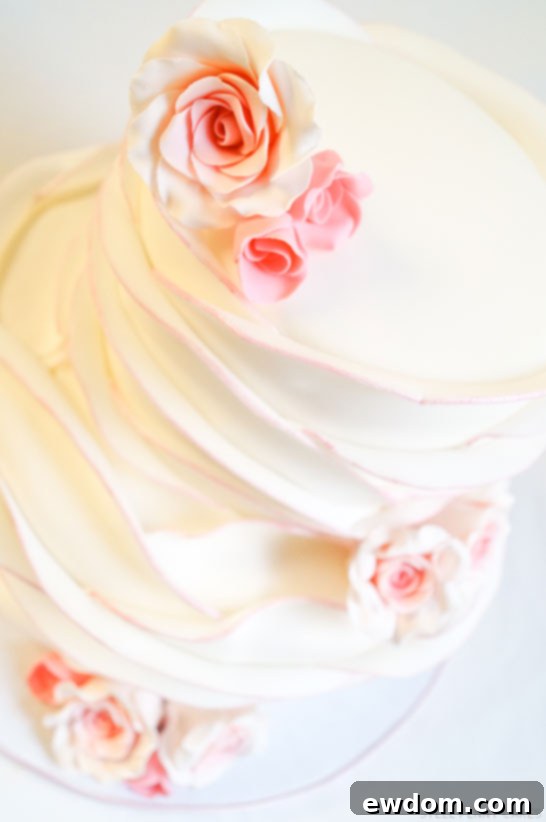 Close-up of the delicate fondant petals and blush pink accents on Steel Penny Cakes' Rose Petal Cake