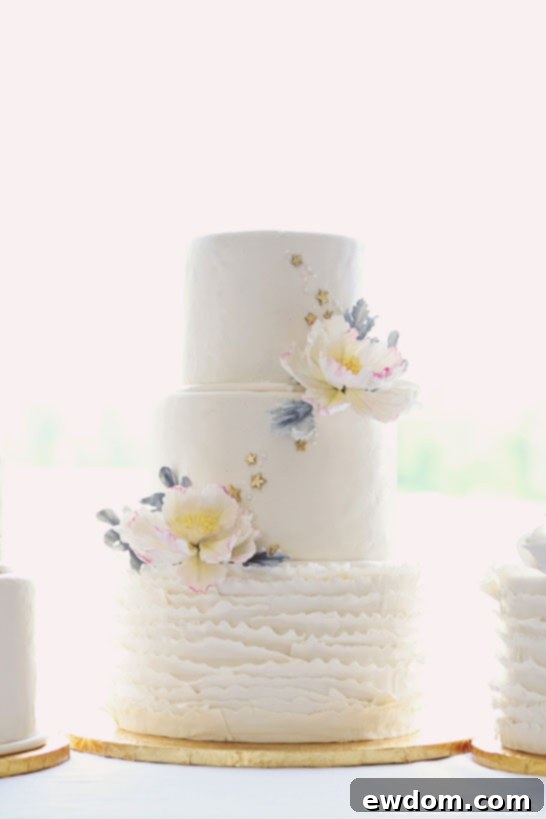 Curated Rustic-Chic Cake Trio 6 Detailed Shot of Ruffles, Sugar Flowers, and Gold Stars on Wedding Cake