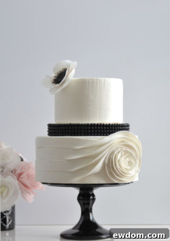 Flowing Rose Cake | by Sweet Charms | TheCakeBlog.com - A masterpiece of fondant art and black and white elegance.