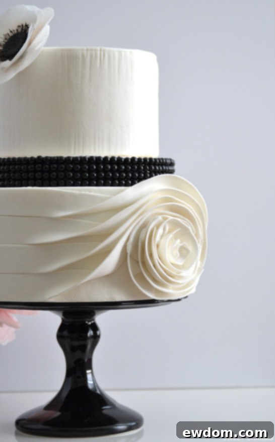 Flowing Rose Cake | by Sweet Charms | TheCakeBlog.com - Close-up of black pearl beads and texturized top tier.