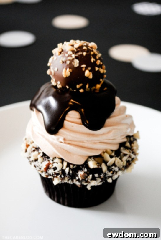 Godiva Hazelnut Crunch Cupcake Recipe Chocolate Truffle Cupcake | dark chocolate ganache with hazelnuts, topped with milk chocolate buttercream, more ganache and a hazelnut crunch truffle | TheCakeBlog.com