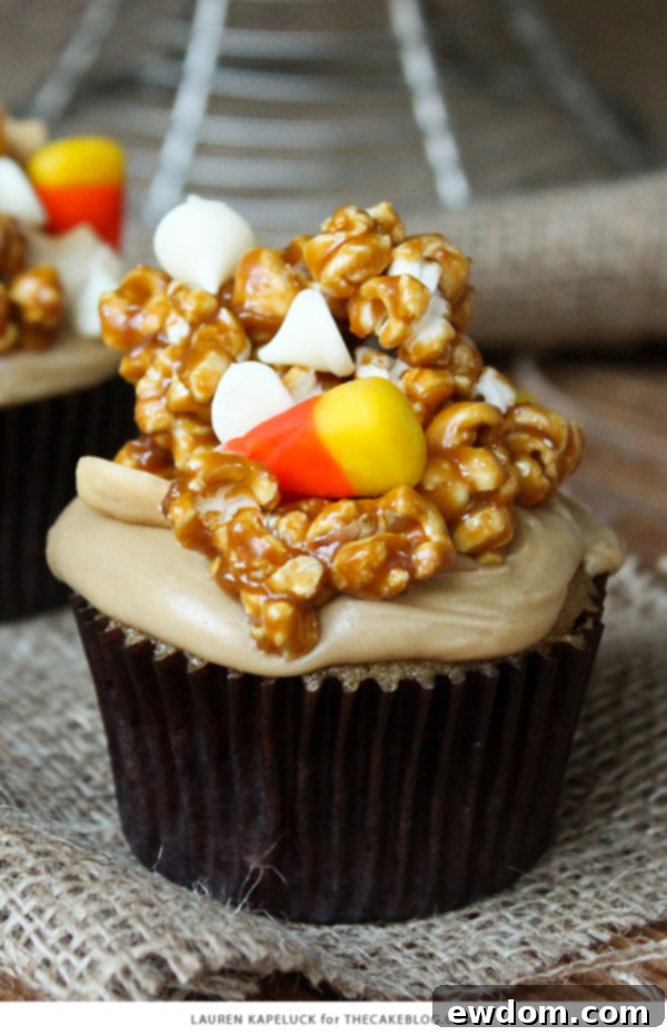 Sweet & Salty Popcorn Cupcakes 8 A vibrant display of completed Caramel Corn Cupcakes, showcasing the delightful combination of caramel cake, frosting, and a generous heap of custom caramel popcorn