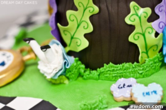 Another perspective of the Alice in Wonderland cake, highlighting various edible elements