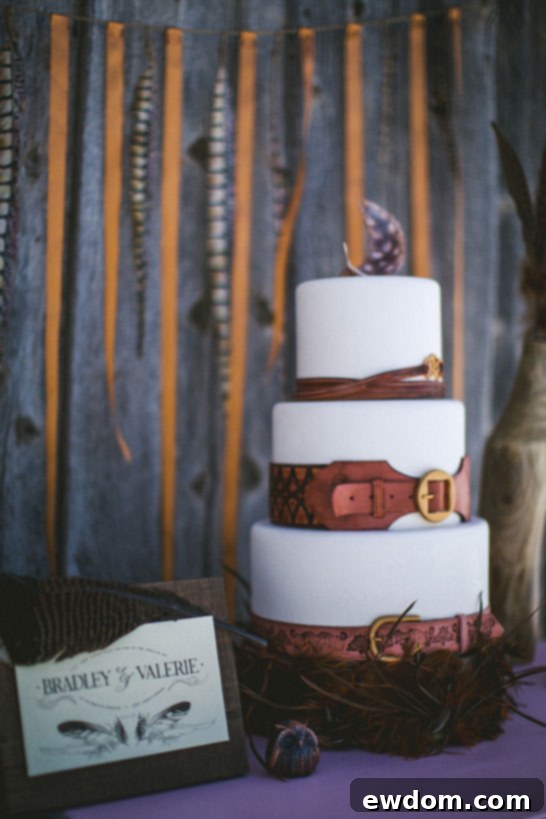 Edible Leather Belts & Feathers Cake by Intricate Icings