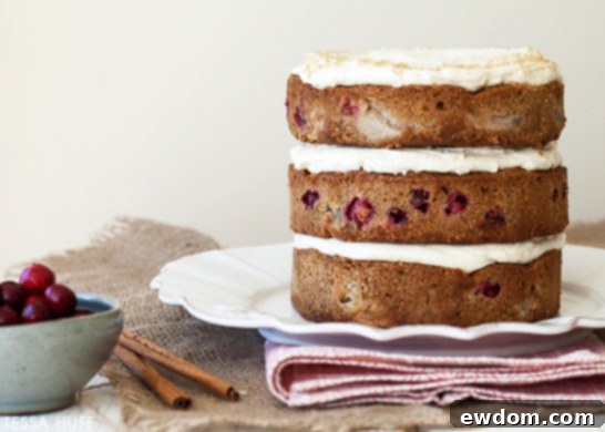 Individual serving of Pear & Cranberry Cake, a perfect holiday dessert.