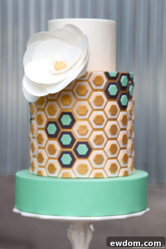 Top view of the Gold & Mint Hexagon Cake with an elegant edible paper flower