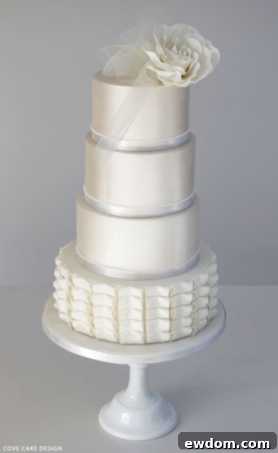 Elegant White Wedding Cake with Pleats and Sugar Rose by Cove Cake Design