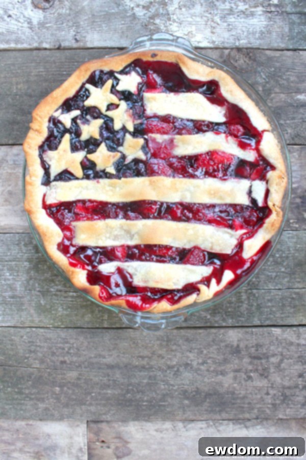 Classic American Flag Pie with berry stripes and star-shaped crust for Fourth of July