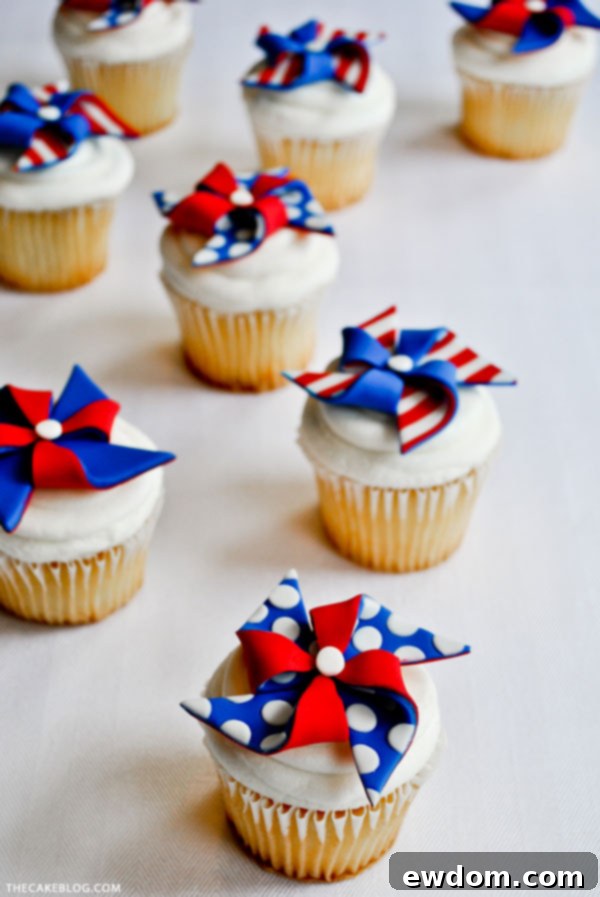 DIY Patriotic Pinwheel Cupcake Toppers adding a festive touch to Fourth of July desserts