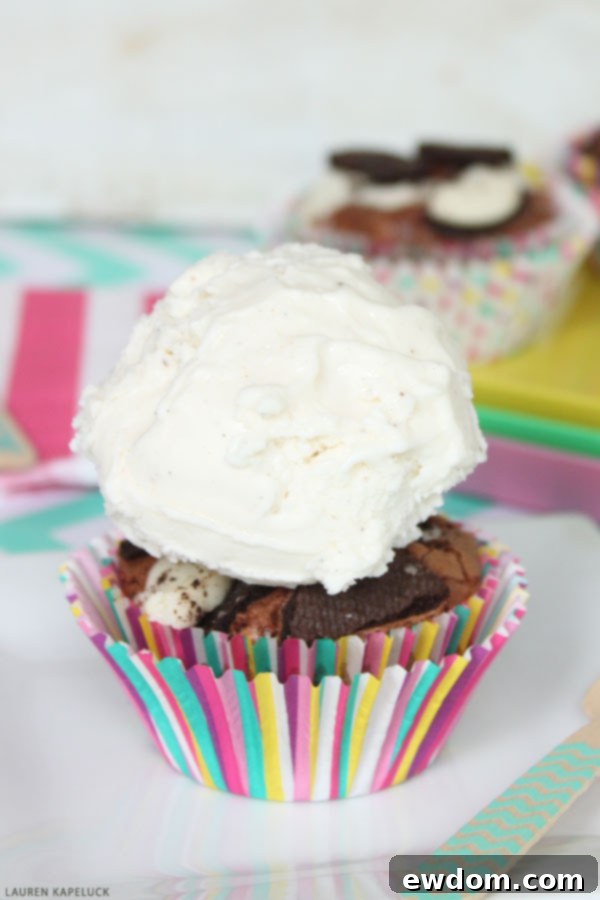 Decadent Brownie Sundae Cupcakes 3 Close-up of baked Brownie Cupcakes, showing the rich texture and Oreo pieces.