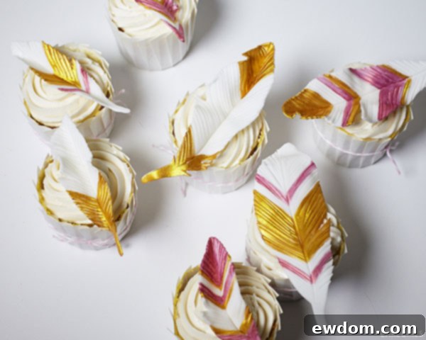 Close-up of a delightful gold and coral feather cupcake ready to be enjoyed