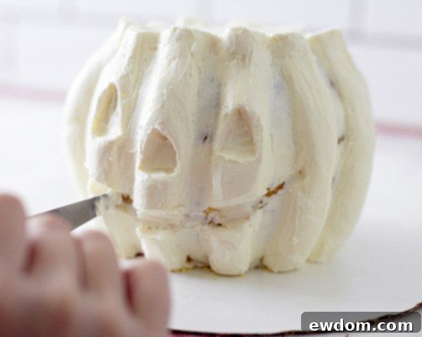 Carving Jack O Lantern Face into Buttercream Pumpkin Cake