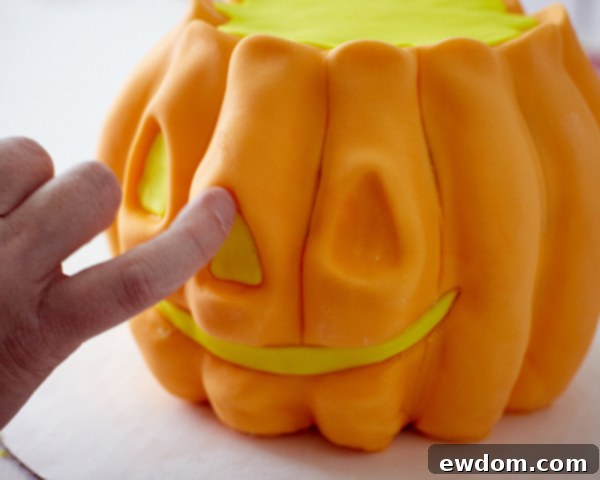 Adding Fondant Face and Luster Dust Shading to Halloween Pumpkin Cake