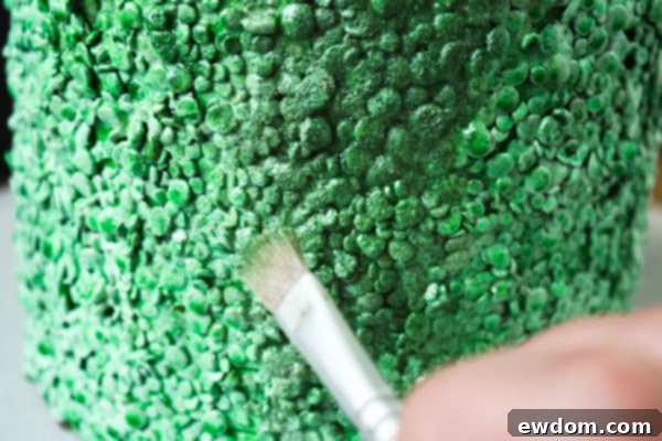 Applying Shimmer Dust to Monster Cake for Glamorous Finish - Step 4