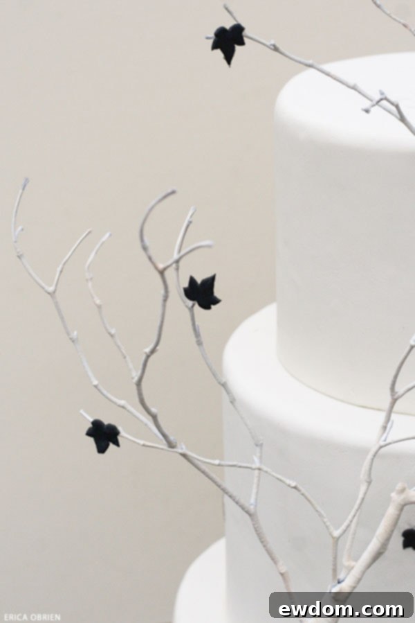 Close-up of Black Falling Leaves on an Ivory Halloween Cake