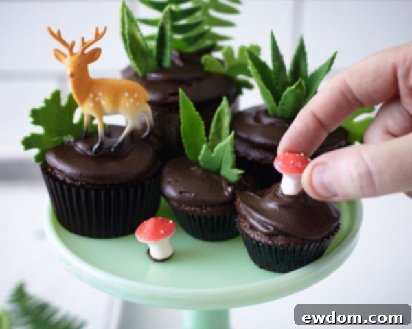 Sweet Little Worlds: DIY Cupcake Terrariums 15 Adding mini gum paste mushrooms to the cupcake terrarium display, securing with buttercream.