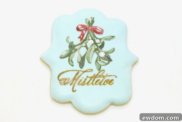 Finished stencil-painted mistletoe cookie, a perfect holiday treat