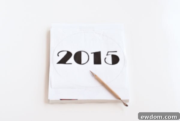 Sparkling Midnight Countdown Cake 11 Carefully cutting the stencil design with a craft knife