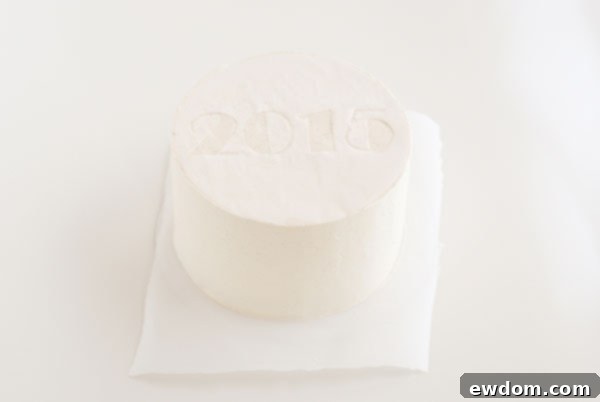 Sparkling Midnight Countdown Cake 13 Placing the parchment stencil onto the chilled cake