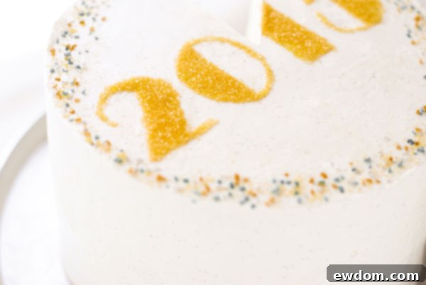 Sparkling Midnight Countdown Cake 21 Decorating the outer edge of the cake with a mix of gold and silver sprinkles