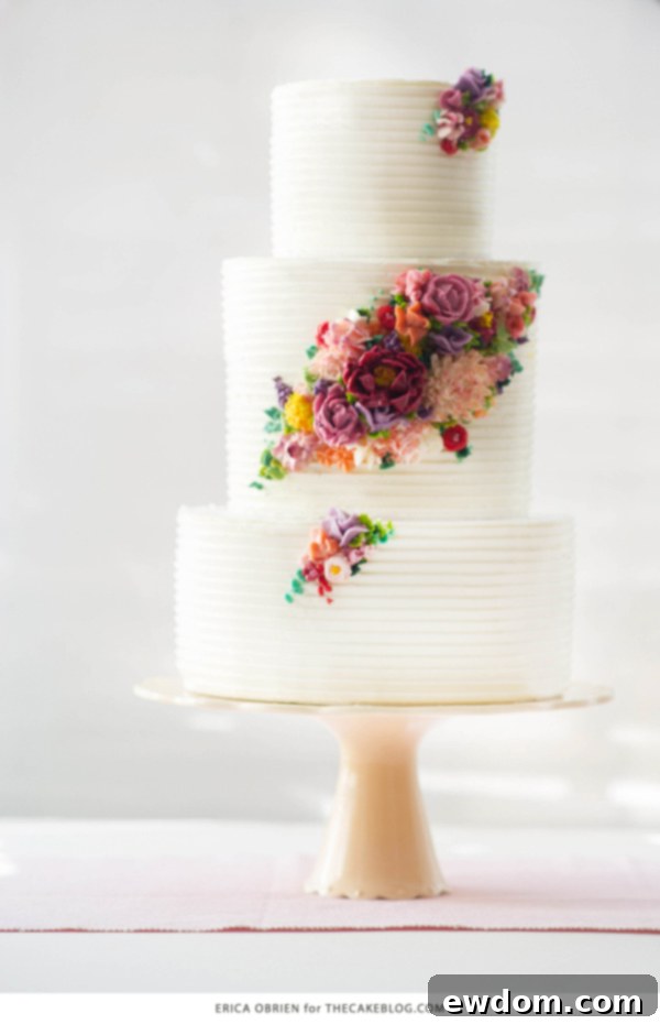Elegant multi-tiered wedding cake with modern buttercream flowers by Erica OBrien Cake Design, a highlight of 2015 trends