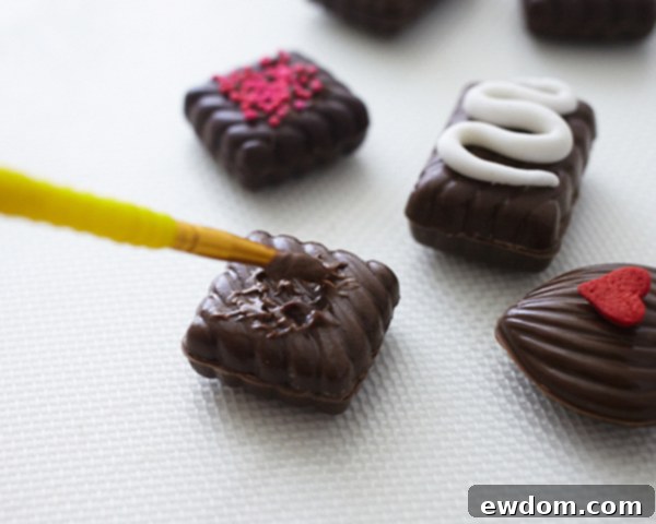 Valentines Candy Heart Surprise Cake 11 Decorating chocolate heart candies with sprinkles and square candies with nonpareils