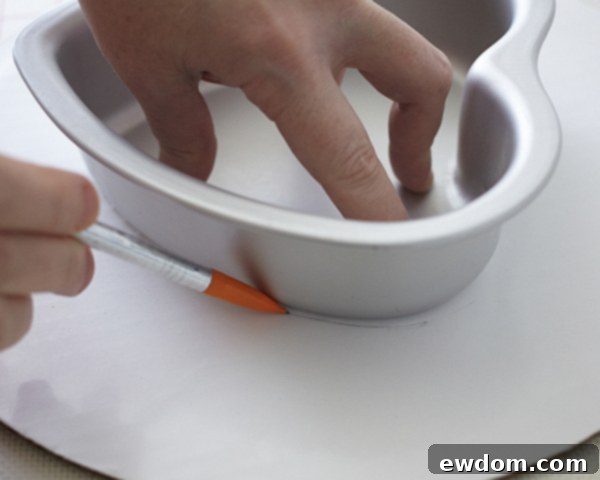 Valentines Candy Heart Surprise Cake 19 Tracing a heart cake pan onto cardboard to create a cake support
