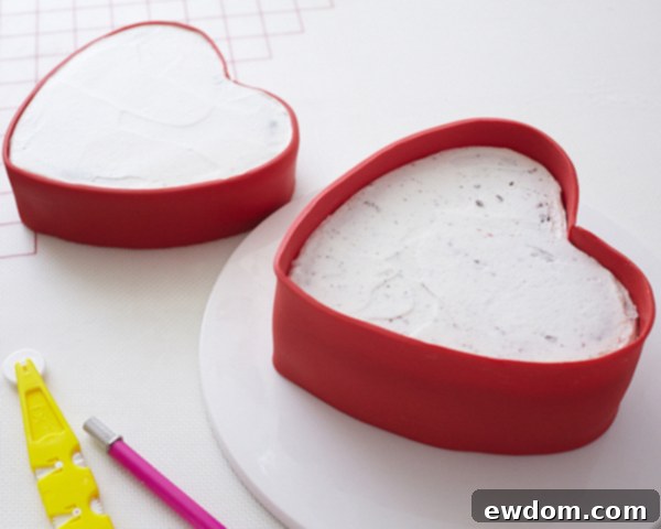 Valentines Candy Heart Surprise Cake 26 Ensuring a smooth and even application of the taller red fondant strip
