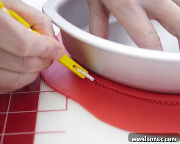 Valentines Candy Heart Surprise Cake 27 Cutting a red fondant heart for the cake lid, using a ridged texture wheel