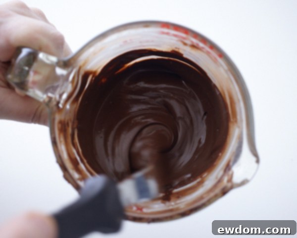 Valentines Candy Heart Surprise Cake 7 Filling chocolate candy mold cavities with melted dark chocolate coating