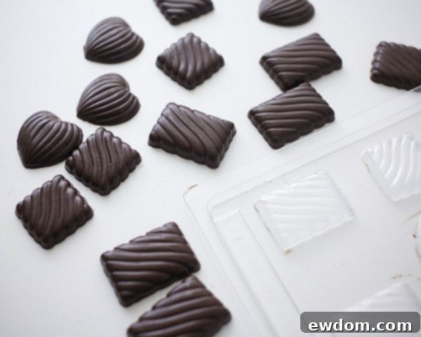 Valentines Candy Heart Surprise Cake 9 Releasing hardened chocolate candies from a silicone mold