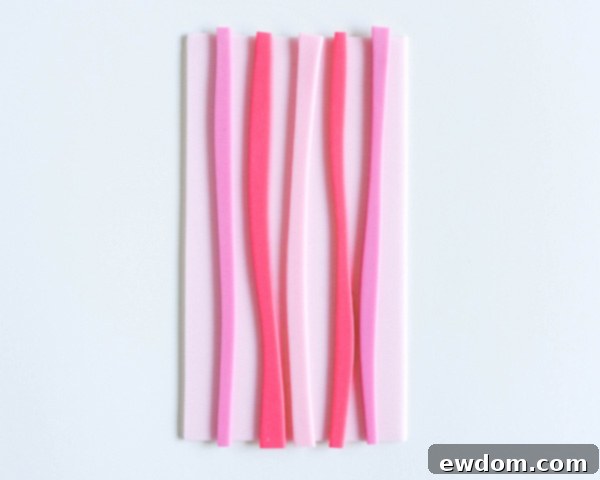 How to make striped heart toppers for cake and cupcakes | Tutorial by AK Cake Design for TheCakeBlog.com