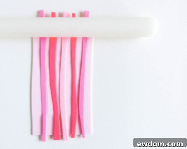 How to make striped heart toppers for cake and cupcakes | Tutorial by AK Cake Design for TheCakeBlog.com