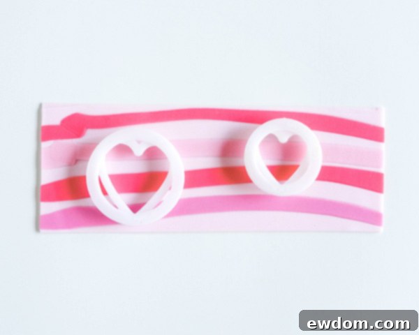 How to make striped heart toppers for cake and cupcakes | Tutorial by AK Cake Design for TheCakeBlog.com