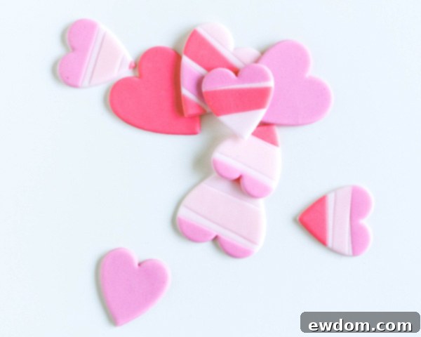 How to make striped heart toppers for cake and cupcakes | Tutorial by AK Cake Design for TheCakeBlog.com
