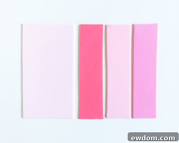 How to make striped heart toppers for cake and cupcakes | Tutorial by AK Cake Design for TheCakeBlog.com