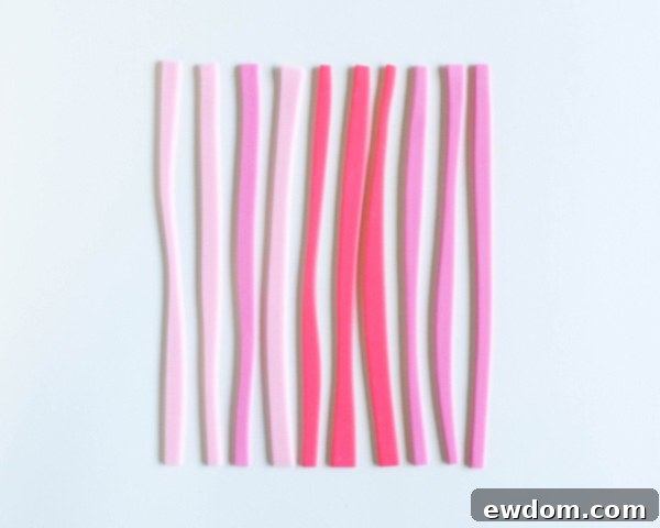 How to make striped heart toppers for cake and cupcakes | Tutorial by AK Cake Design for TheCakeBlog.com