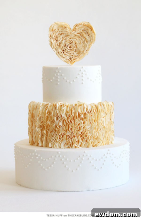 10 Cakes You'll Crave 5 Unique vertical golden-edged frills cake with a delicate ruffled heart topper by Tessa Huff of Style Sweet CA for modern romantic events