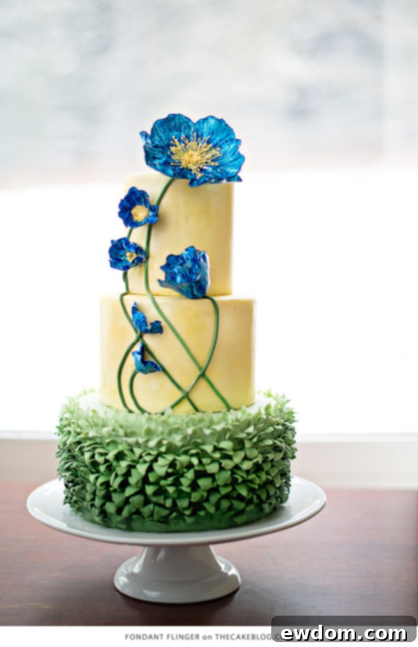 10 Gorgeous Flower Cakes to Welcome Spring 9 Vibrant blue poppy cake by Fondant Flinger, inspired by antique painting, with unique ruffle base.